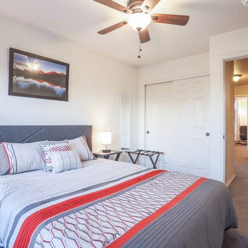 Enjoy deep sleep in this bedroom with a queen size bed that feels open, tidy, and refreshingly calm.