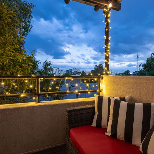 Enioy a private balcony off the primary suite.
