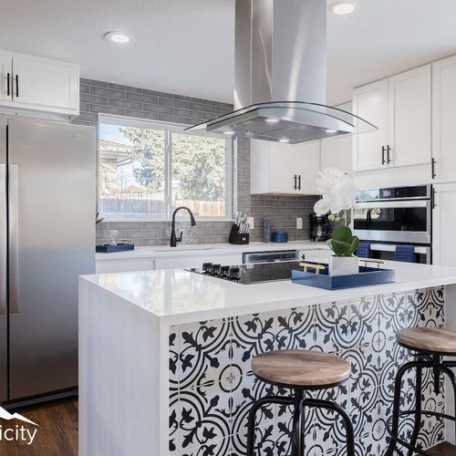 The gorgeous kitchen island is the highlight and centerpiece of this immaculately designed home.