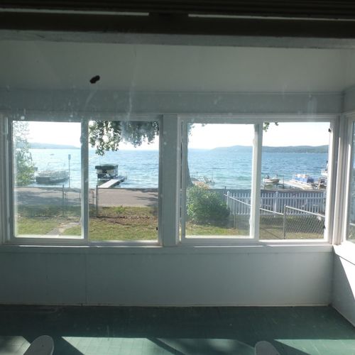 Porch:  the cottage has a huge wrap-around porch that is fully enclosed and has great views of crystal lake!