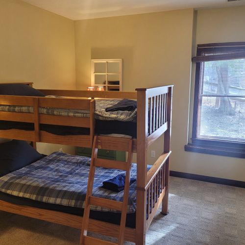 Bedroom #4 (lower level):  includes a twin-on-twin bunk bed, dresser, closet, nightstand, and lamps