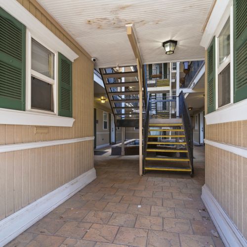 Breezy covered walkway leading you right into your home away from home