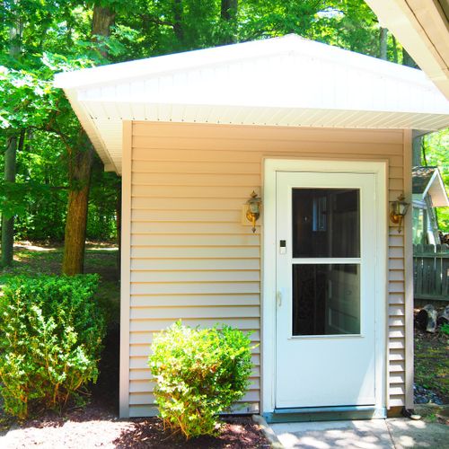 Exterior:  there's a cute little "she shed" / storage area next to the house.