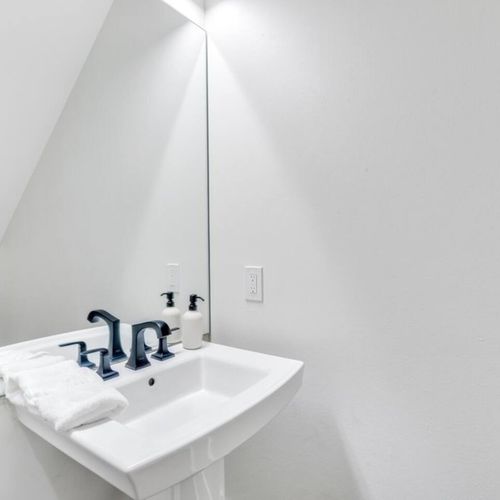 Clean downstairs half bath — compact & convenient for guests.