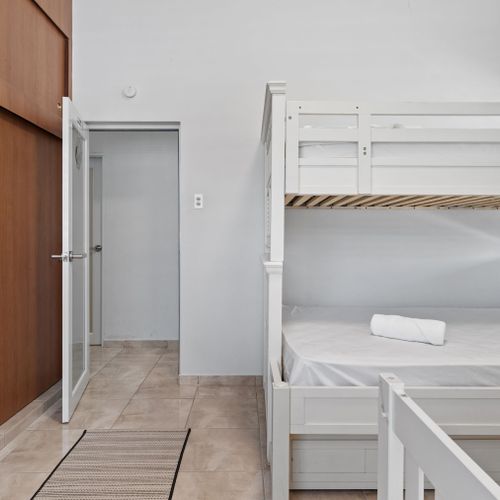 Versatile sleeping: Bunk bed with trundle, plus an extra bed.