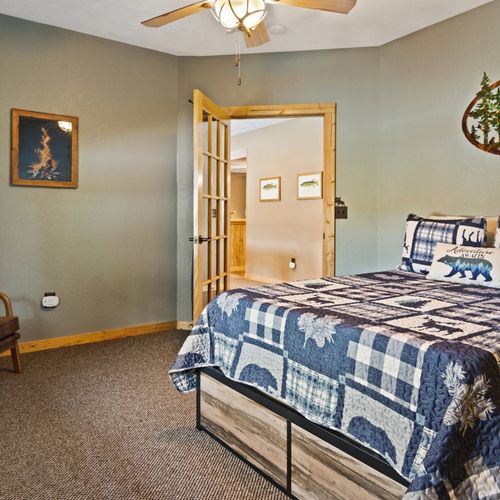 Bedroom #3 (lower level):  features a full-size bed, chair, and closet.