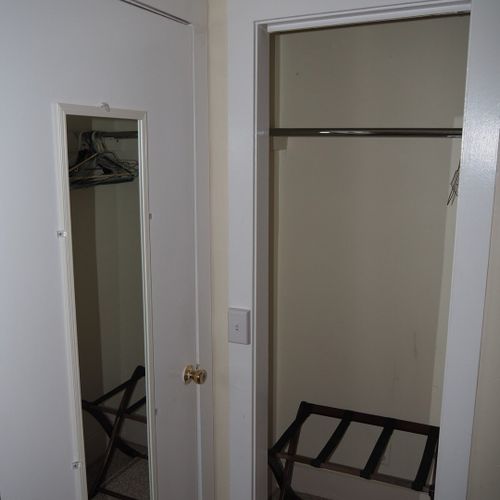 Bedroom #2:  features two twin beds, a nightstand, lamp, dresser, mirror, and closet.
