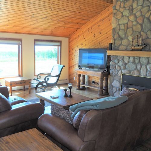 Living room:  the cabin has a huge living room with a gas fireplace and 
 great lake views!