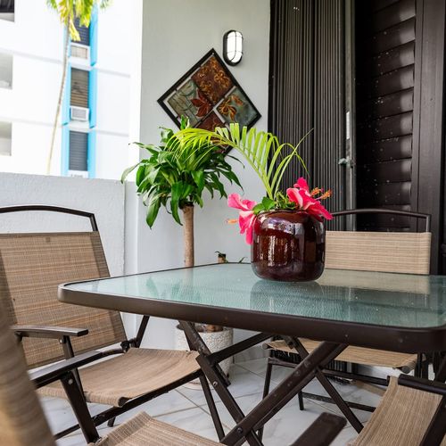 Step out onto your private balcony and enjoy the Malolos breeze! Furnished with comfortable seating and a table, it's the perfect spot for morning coffee or an evening drink.