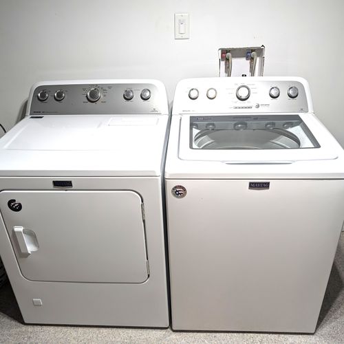 LAUNDRY ROOM (LOWER LEVEL):  Wonderfully large laundry room in the basement with a washer, dryer, and folding / ironing table with an iron as well.
