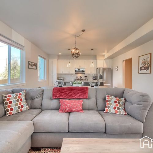 Step inside and you'll be met with a cozy and inviting living room, ideal for entertaining or curling up with a book.