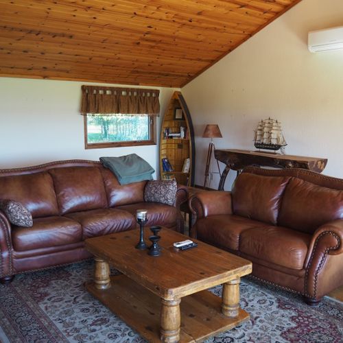 Living room:  the cabin has a huge living room with a gas fireplace and 
 great lake views!