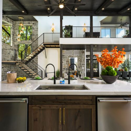 The kitchen is equipped with two dishwashers.