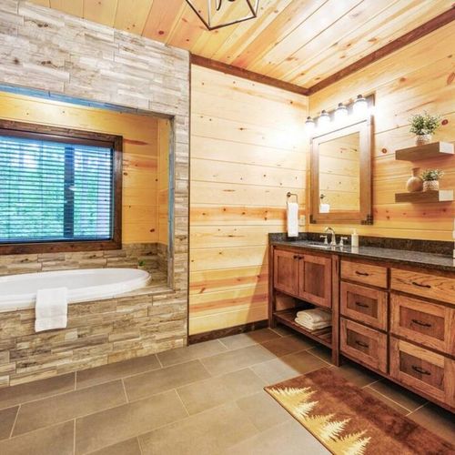 The Master bathroom with a double vanity and soaking tub.