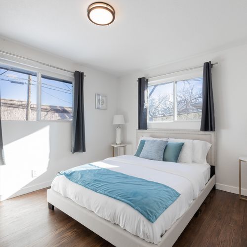 The second upstairs bathroom features a queen size bed and large windows that let in tons of natural light!