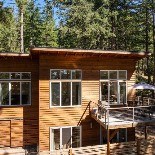 Tall windows let in the light and views, or enjoy the outdoors on the patio outside of the dining room.