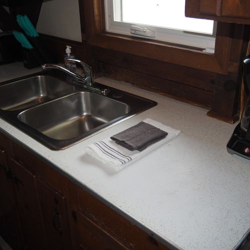 Kitchen:  the cottage has a small kitchen with all appliances except for a dishwasher. It does include a separate beverage cooler as well as a good supply of cooking and dining utensils.