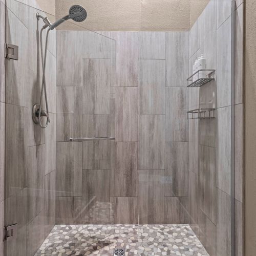 Step into a walk-in shower for comfort with a spa-like touch.