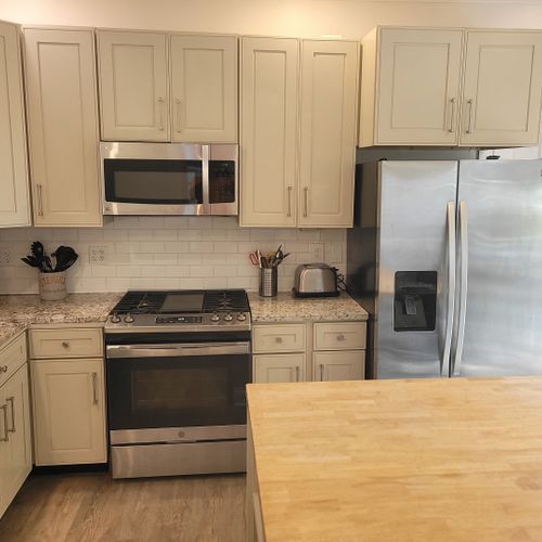 Kitchen:  the home has a newly-renovated kitchen with a large kitchen island and all appliances, including a dishwasher. There is also a good supply of cooking and dining utensils provided.