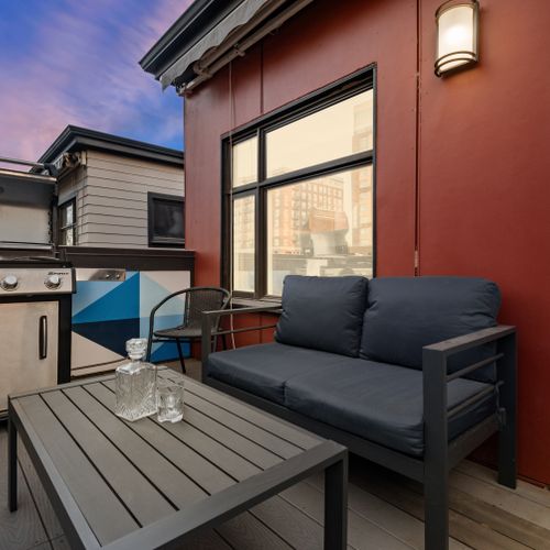 Private balcony with cozy seating, perfect for morning coffee or night bbq