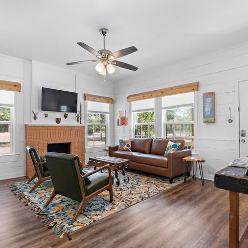 Living Room area with comfy seating and Smart TV for streaming your favorite shows.