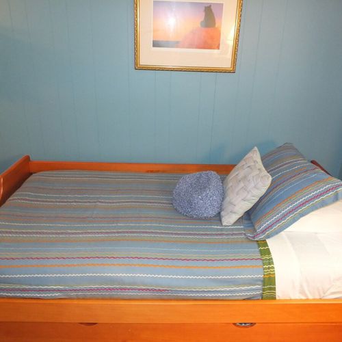 Bedroom #3:  features a trundle (i. E. 2 twin beds), a dresser, and a closet.