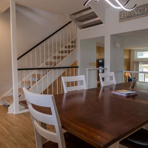Map out seaside adventures together at the spacious, light-filled dining table.