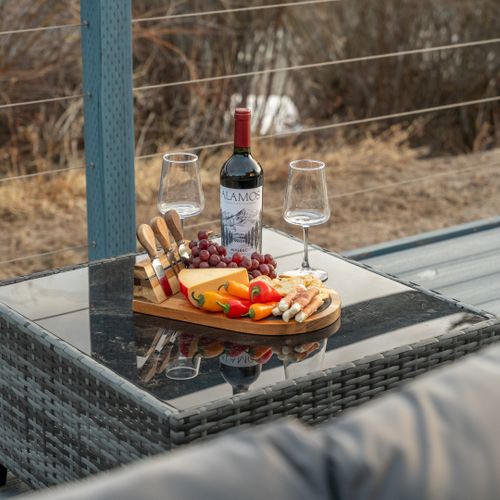 Enjoy alfresco dining on the spacious deck, framed by trees and fresh mountain air.
