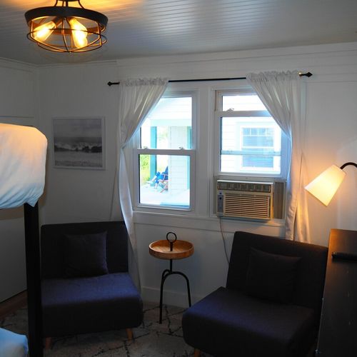 Bedroom #3:  features a queen-on-queen bunk bed, two cozy chairs that fold out into beds, a dresser, closet, and its own private television.