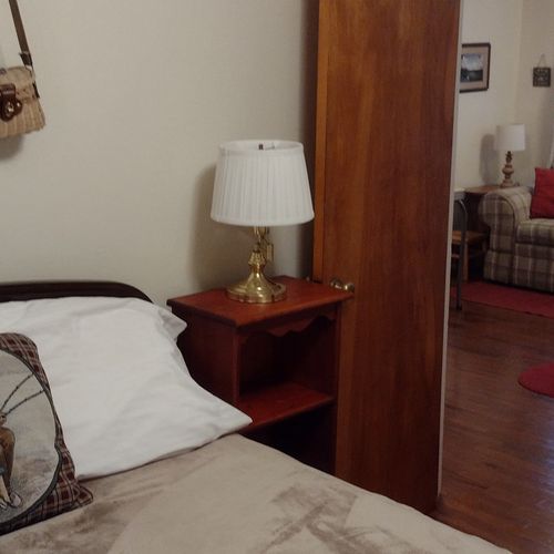 Bedroom #2:  features a full-size bed, nightstand, lamp, dresser. And closet.