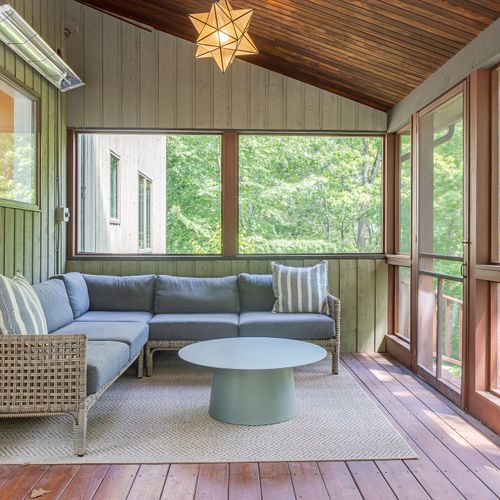 An enclosed porch allows you to be close to nature without worry of bugs.