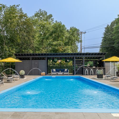 A lounge, bar, and poolside powder room complete the setup for a perfect afternoon.
