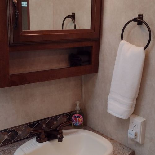 Bathroom #2:  full bathroom with a shower, sink, vanity, and toilet.