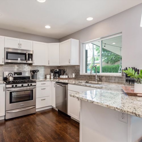 The kitchen offers ample counter space, updated stainless appliances and all kitchen necessities required for your next meal