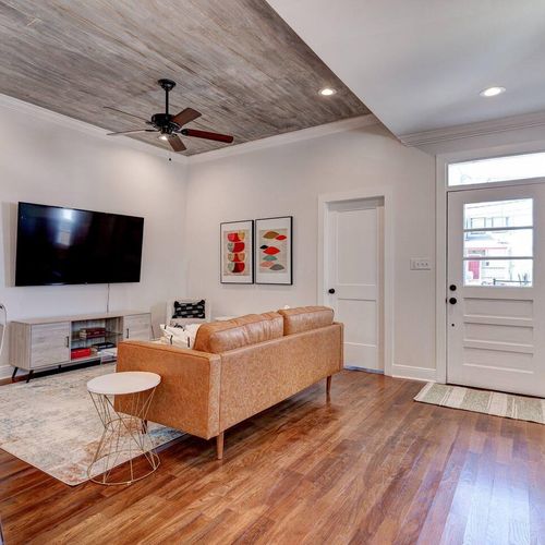 Kick back in the living room w/ a large flat-screen TV — Netflix nights sorted.