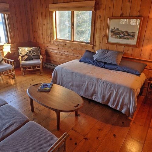 Bedroom #3 (second floor):  the home has another huge bedroom on the second floor that has a spectacular view of crystal lake, a queen-size bed, its own television, and it's own sitting area. (note that the fireplace in the room is not usable. )