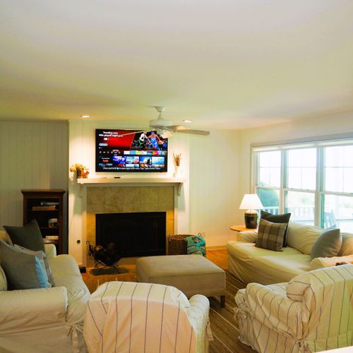 Living room:  the home has a super comfy living room with a wood fireplace and great view of the backyard, long lake, and sleeping bear dunes in the distance.