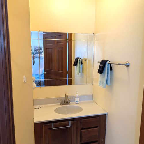 BATHROOM #3:  This is a "jack and jill full bathroom" with private entrances from both Bedroom #3 and Bedroom #4.  Includes 2 separate sinks each with a mirror and vanity along with a toilet and a combination tub and shower.