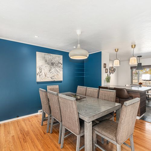 Enjoy meals with family and friends in this spacious dining area, comfortably seating 8 for memorable gatherings.