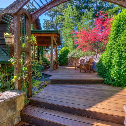 Gardens and decks meander through the back of the property