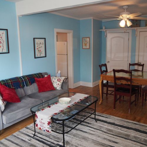 Dining area:  there is a hand-painted square dining table between the kitchen and living room with seating for 4 adults.