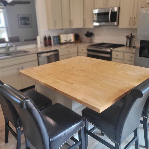 Kitchen:  the home has a newly-renovated kitchen with a large kitchen island and all appliances, including a dishwasher. There is also a good supply of cooking and dining utensils provided.