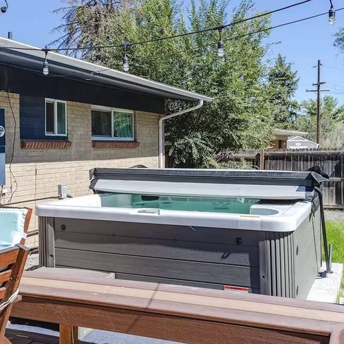 - soothe your muscles in the private hot tub after a day of hiking or skiing
- surrounded by string lights and tucked beside the house for extra privacy
- perfect evening retreat for couples, families, or solo travelers