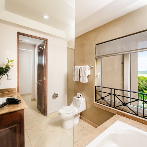 Master bathroom with a tub