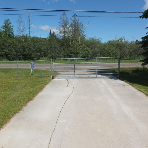 Exterior:  as shown, the entrance is gated and the gate just manually rotates to open and close.