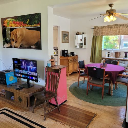 Living room:  the home has a very cozy living room with 2 sofas, a comfy chair, and a television.
