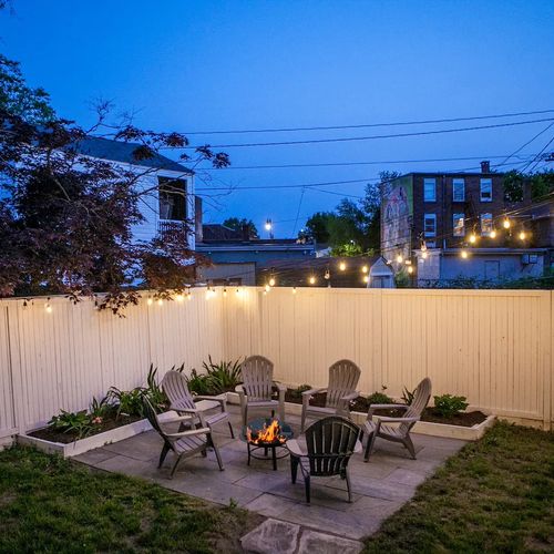 Unwind at night on the bluestone patio, perfect for bonfires under the lights in the heart of Kingston