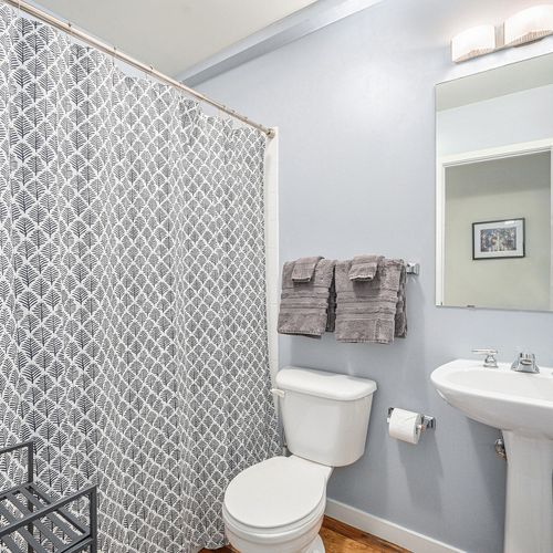 Full bathroom located off the main living area.