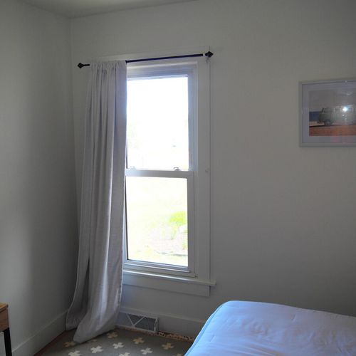 Bedroom #2:  features a queen-size bed, nightstands, desk, and a large wall closet.
