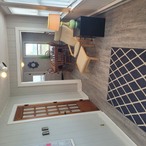 Beach house - living room:  not very large, but comfy with incredible views of lake huron! Great for reading and relaxing!